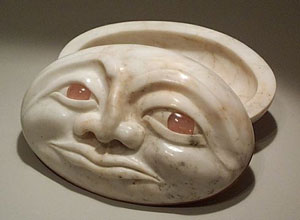 The Great Pink Face is a fine art sculpture in rare California pink Alabaster stone that hides a precious container and is inlaid with rose quartz eyes.