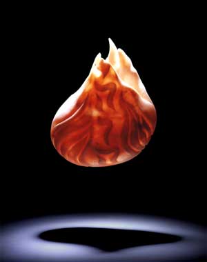 The Jewish Eternal Light symbolizes the burning bush and adorns the temple alter, a Alabaster stone sculpture by Susan Zalkind